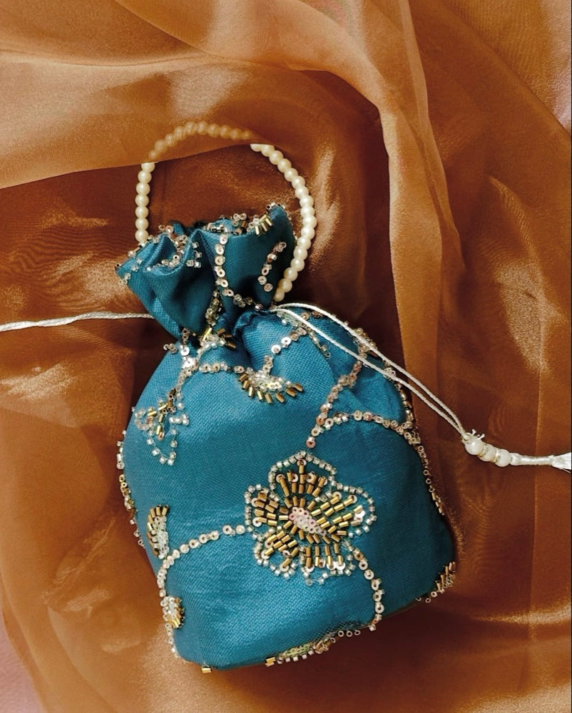 Roshan Aara: Teal Net Potli Bag with Hand-Embroidered Gold Cutdana Work