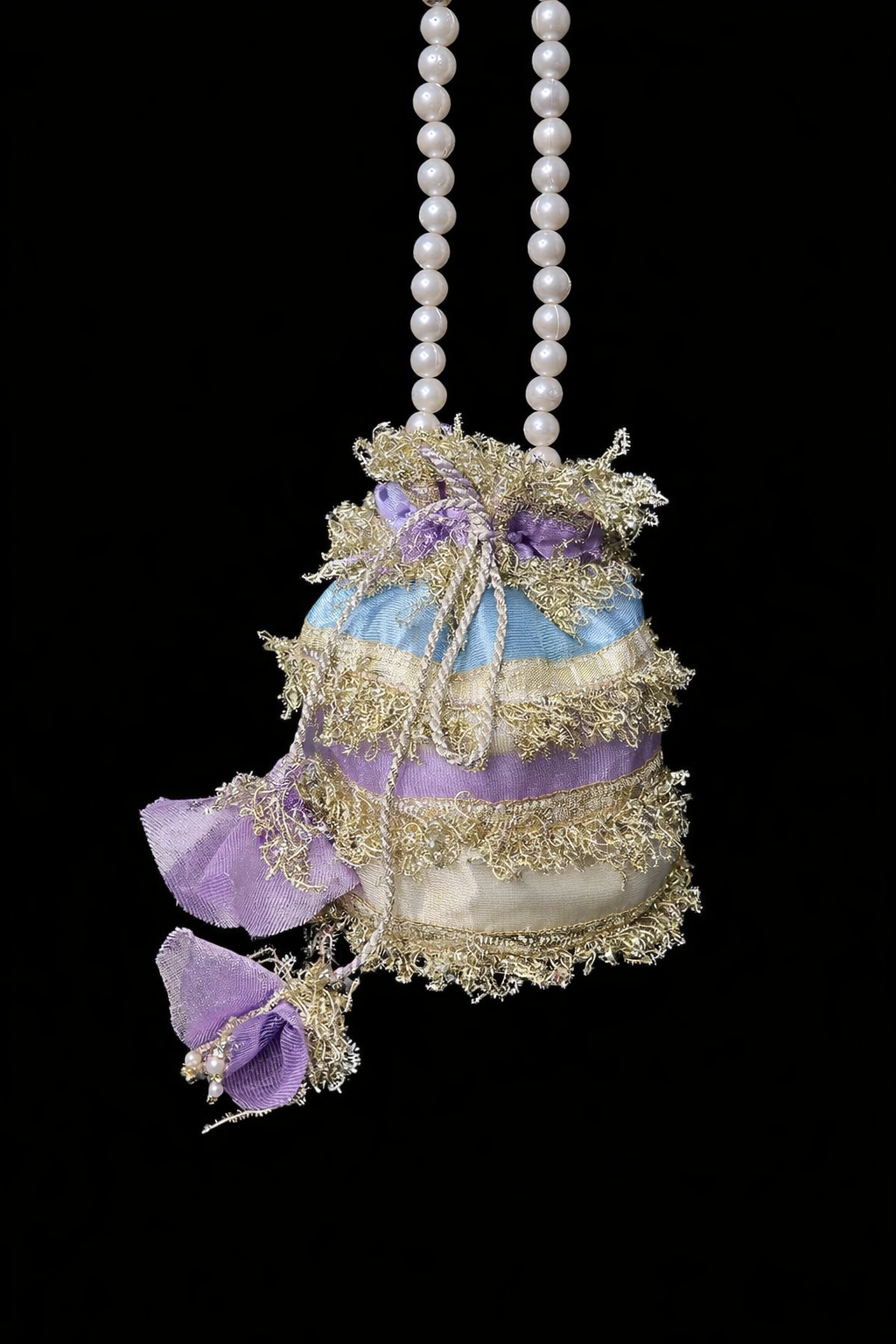 Nigaar: Pastel Striped Potli with Gold Gota & Pearl Handle