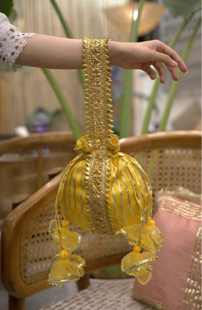 Zahrah Yellow Silk Potli Bag with Gold Gotta Patti Work