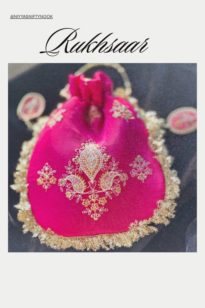Rukhsaar: Hot Pink Silk Potli with Hand-Embroidered Gold Motifs & Fringe Border