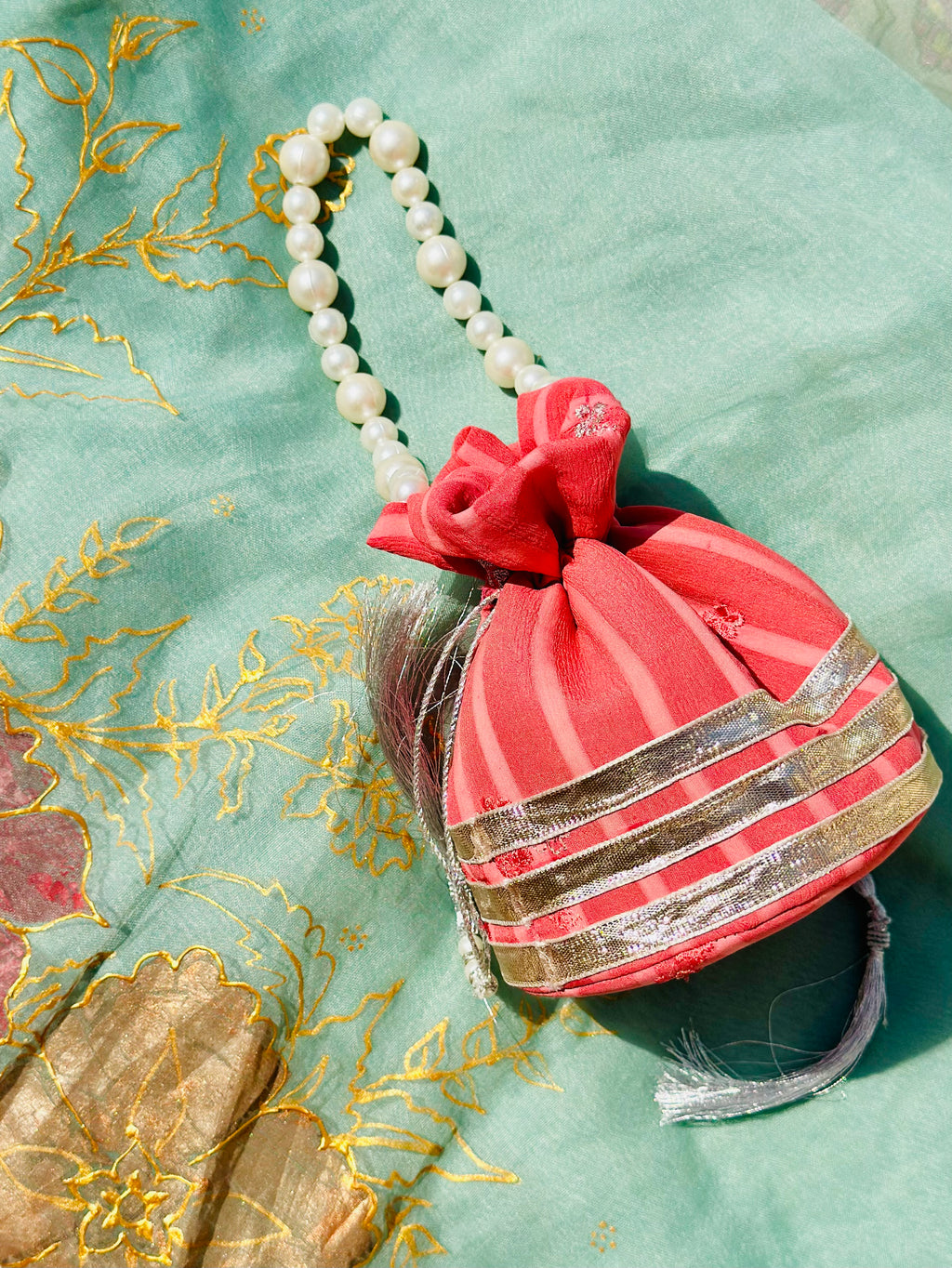 Bakhtawar: Coral Chiffon Potli with Pearl Handle & Silver Gota