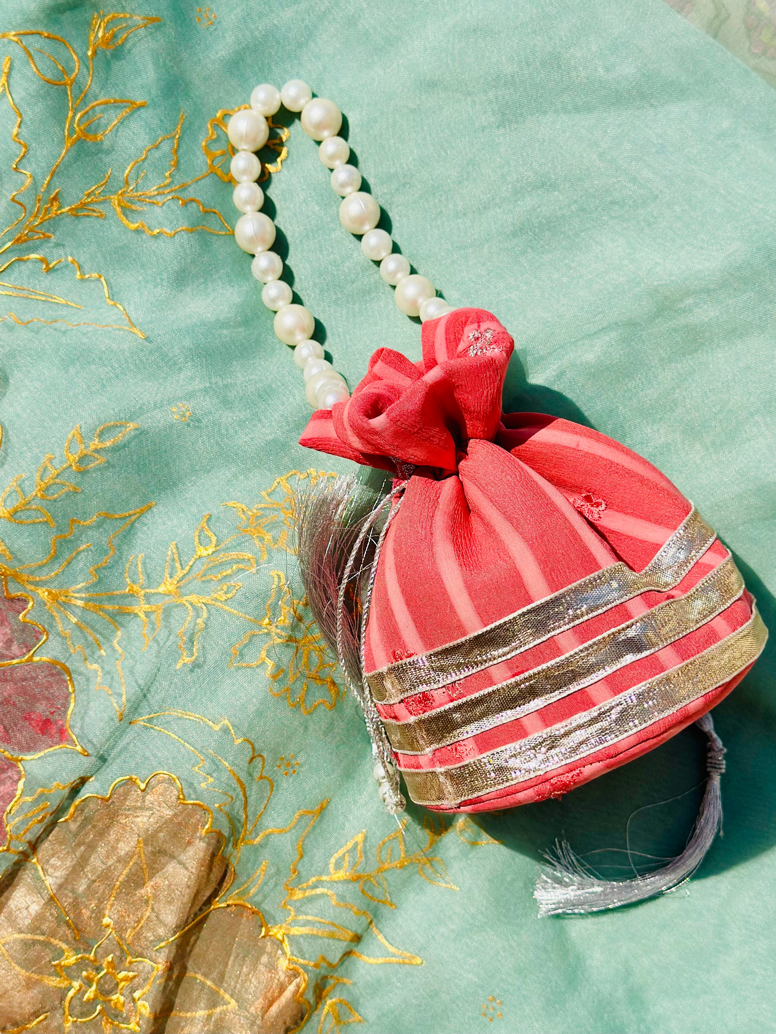 Bakhtawar: Coral Chiffon Potli with Pearl Handle & Silver Gota