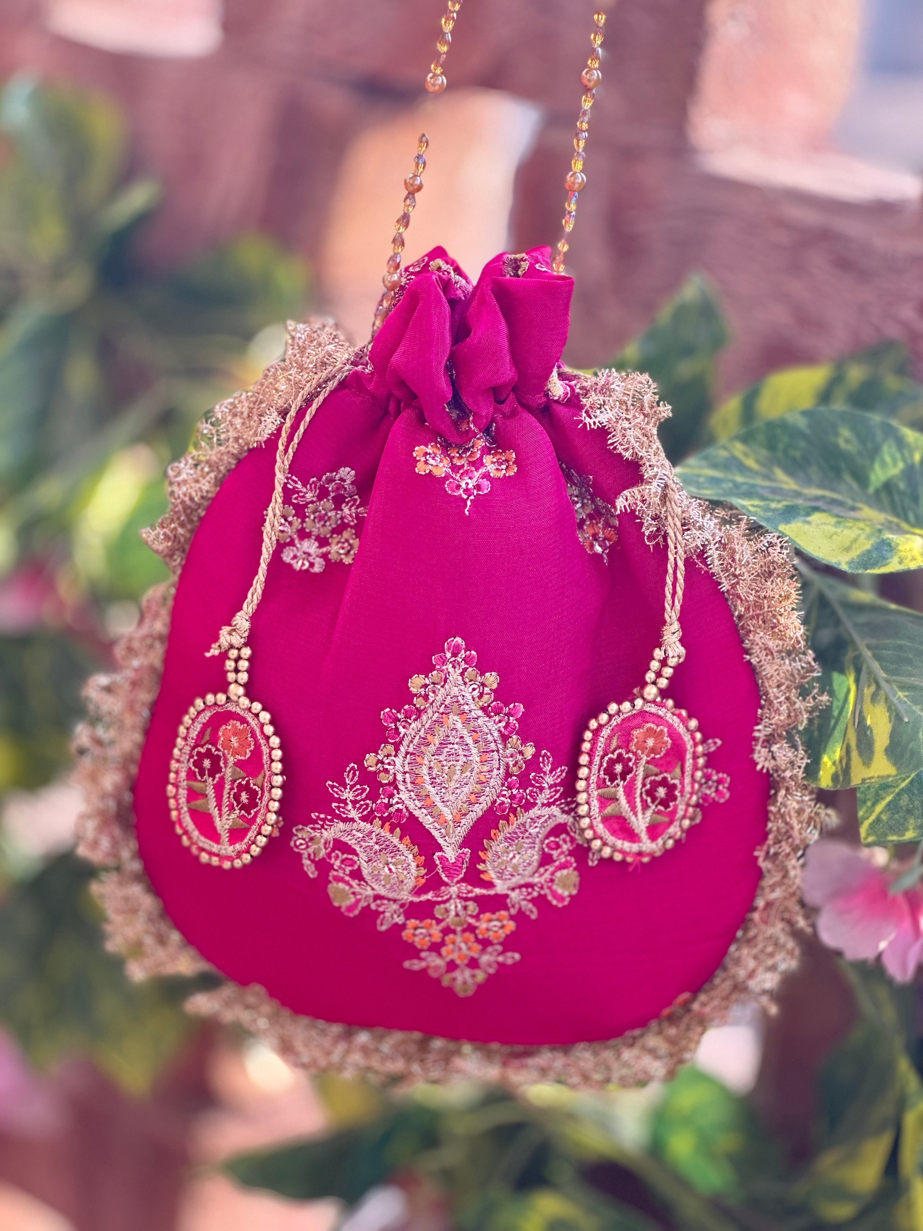 Rukhsaar: Hot Pink Silk Potli - Gold Motifs & Fringes