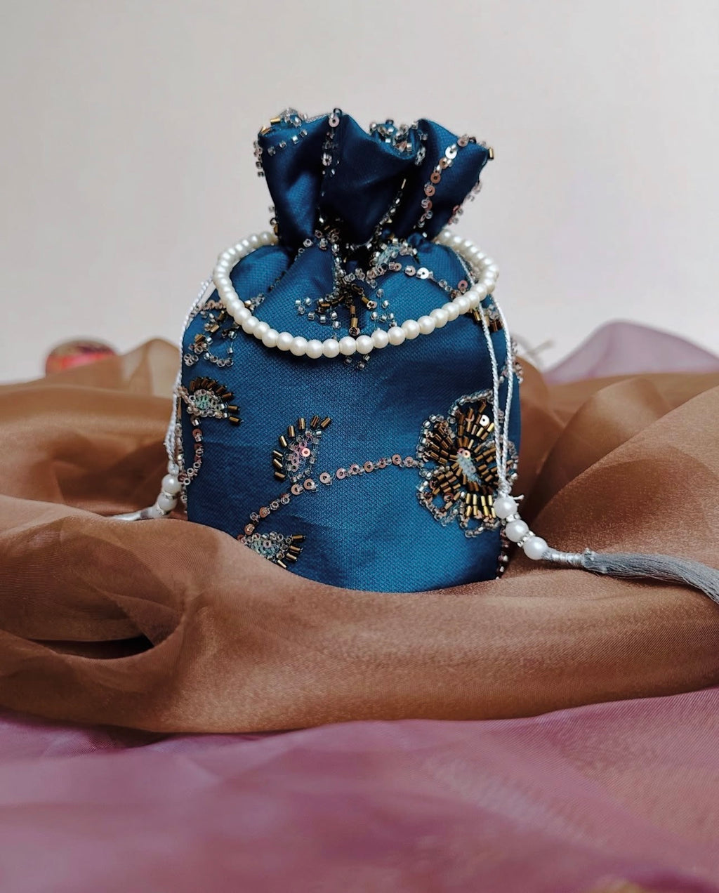 Roshan Aara: Teal Net Potli with Gold Cutdana Embroidery