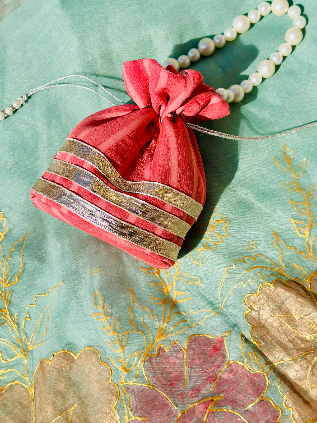 Handcrafted Coral Chiffon Potli Bag with Pearl Handle & Silver Gota Lace - Striped Festive Clutch