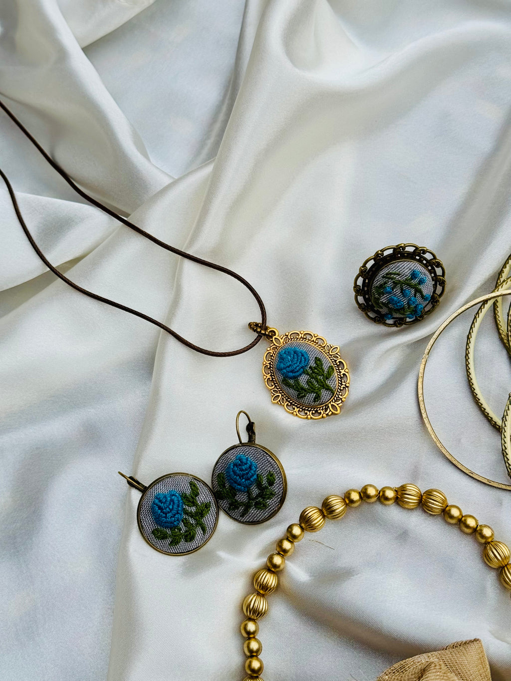 Hand-Embroidered Blue Rose Pendant - Vintage Gold Filigree Cameo Necklace - Artisan Hand-Stitched Jewelry