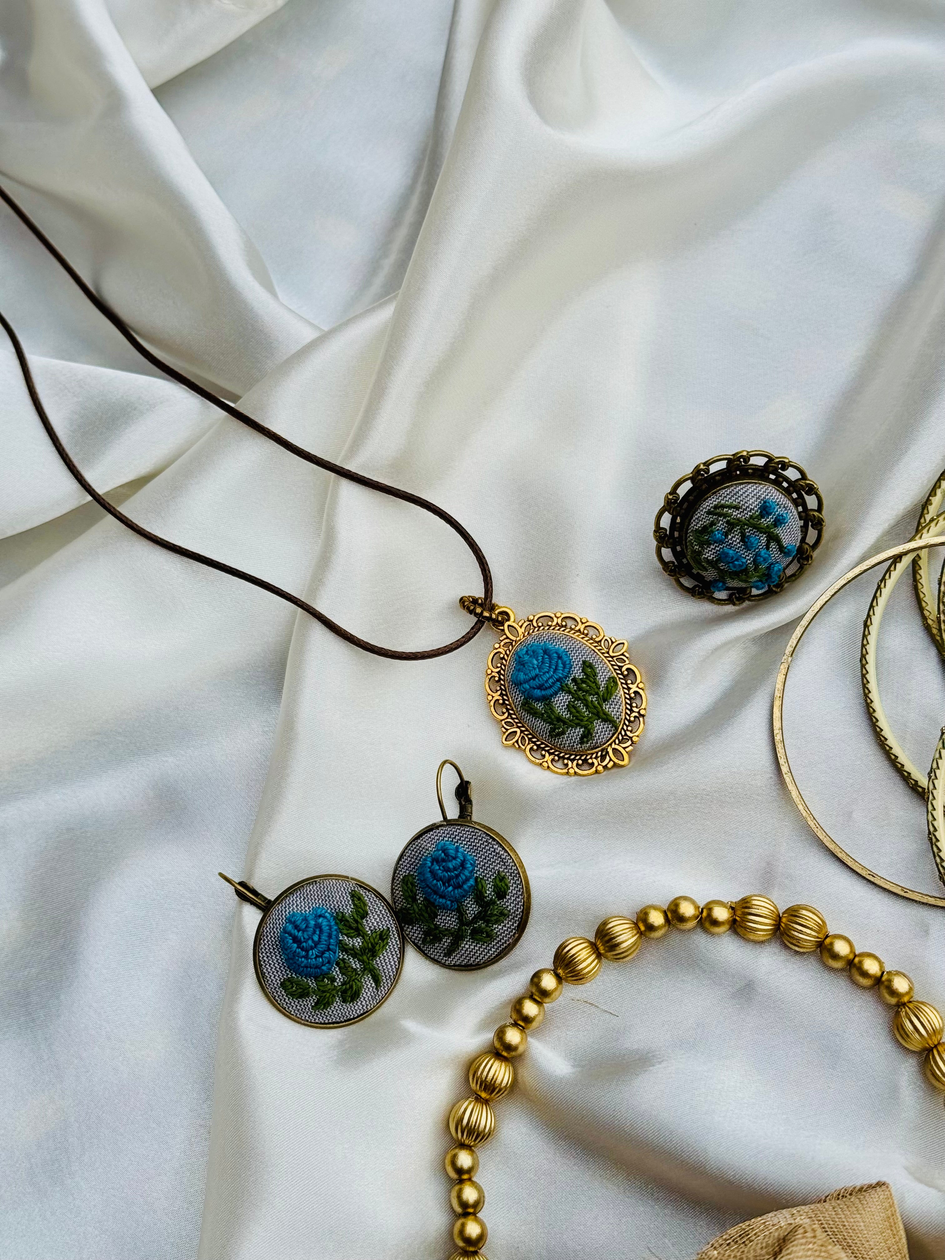 Hand-Embroidered Blue Rose Pendant - Vintage Gold Filigree Cameo Necklace - Artisan Hand-Stitched Jewelry