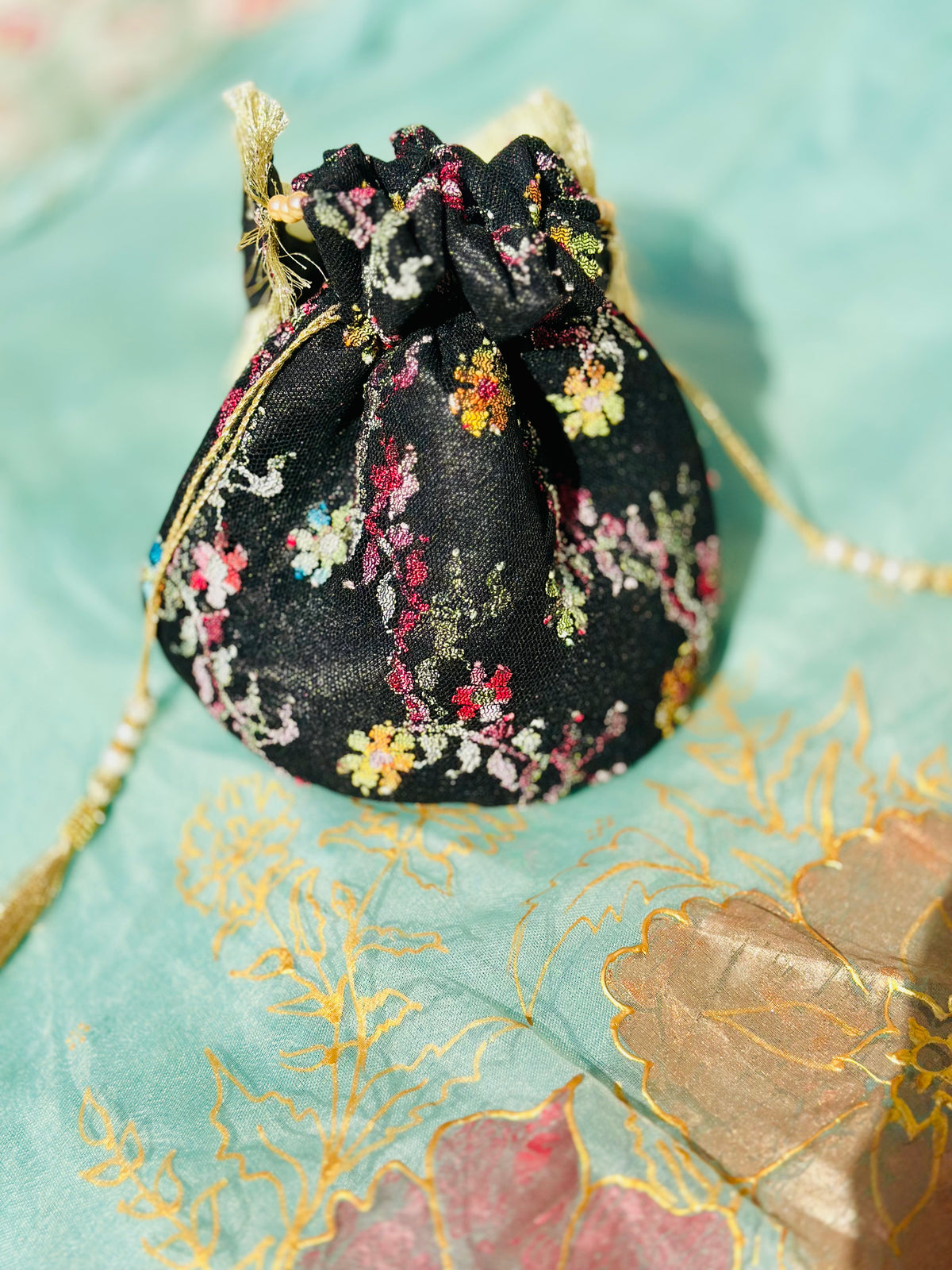 Sahar Handcrafted Floral Jacquard Potli Bag | Black & Gold Fringe Clutch