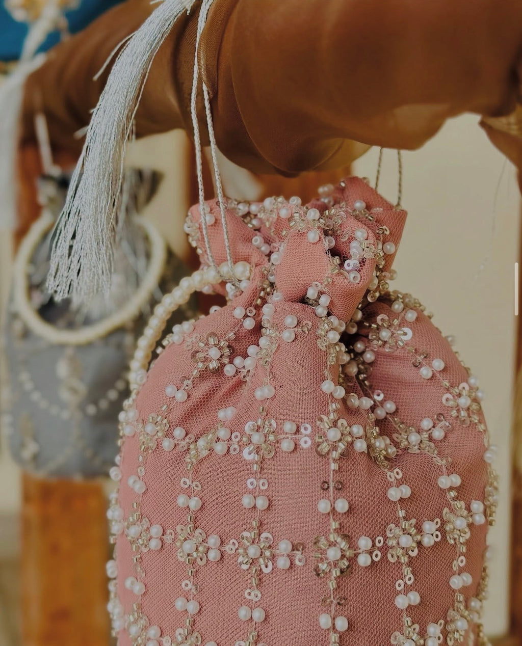Shafaq: Pink Hand-Embroidered Pearl & Sequin Net Potli