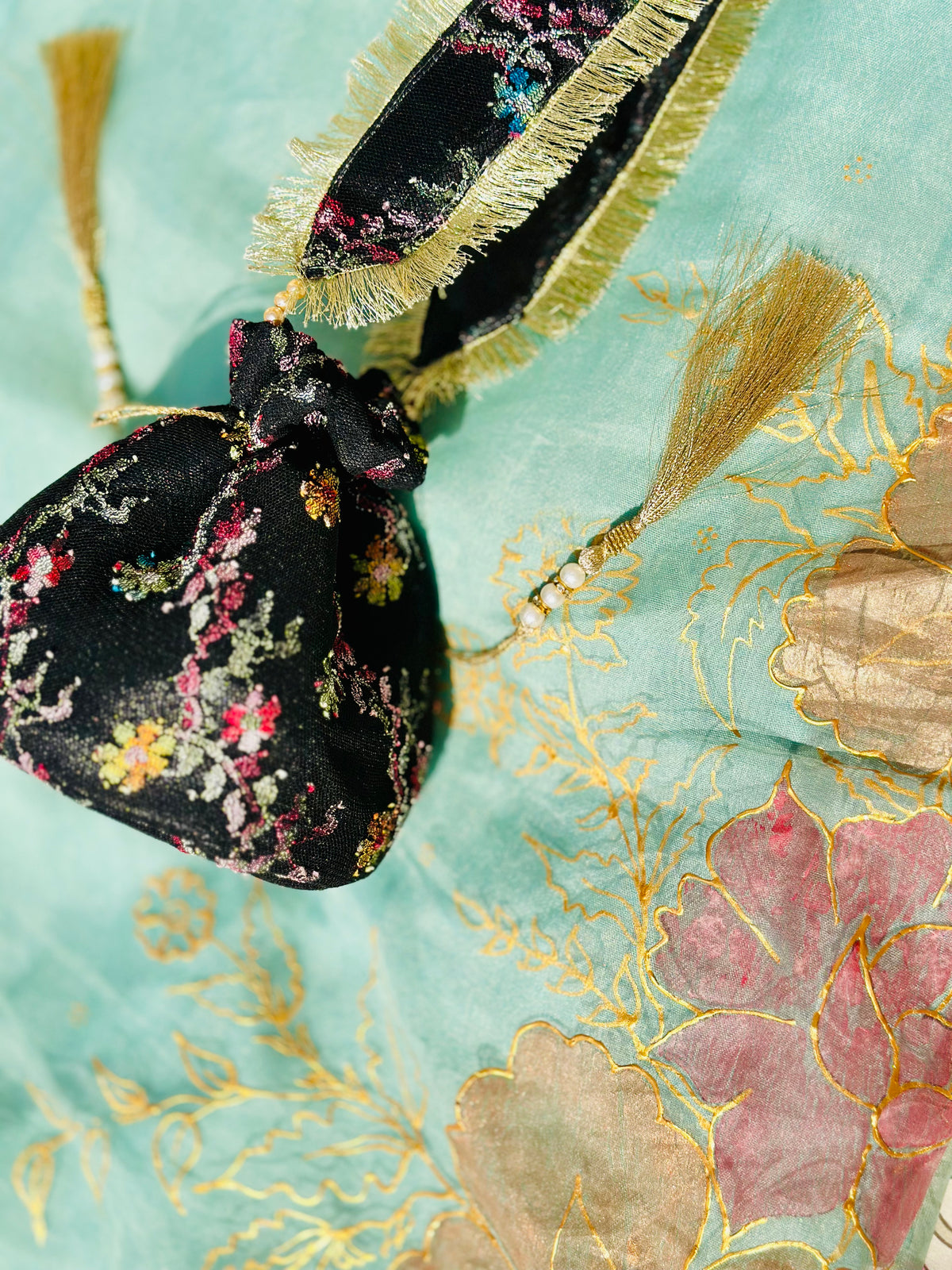 Sahar Handcrafted Floral Jacquard Potli Bag | Black & Gold Fringe Clutch