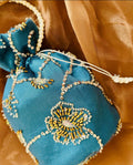 Roshan Aara: Teal Net Potli with Gold Cutdana Embroidery