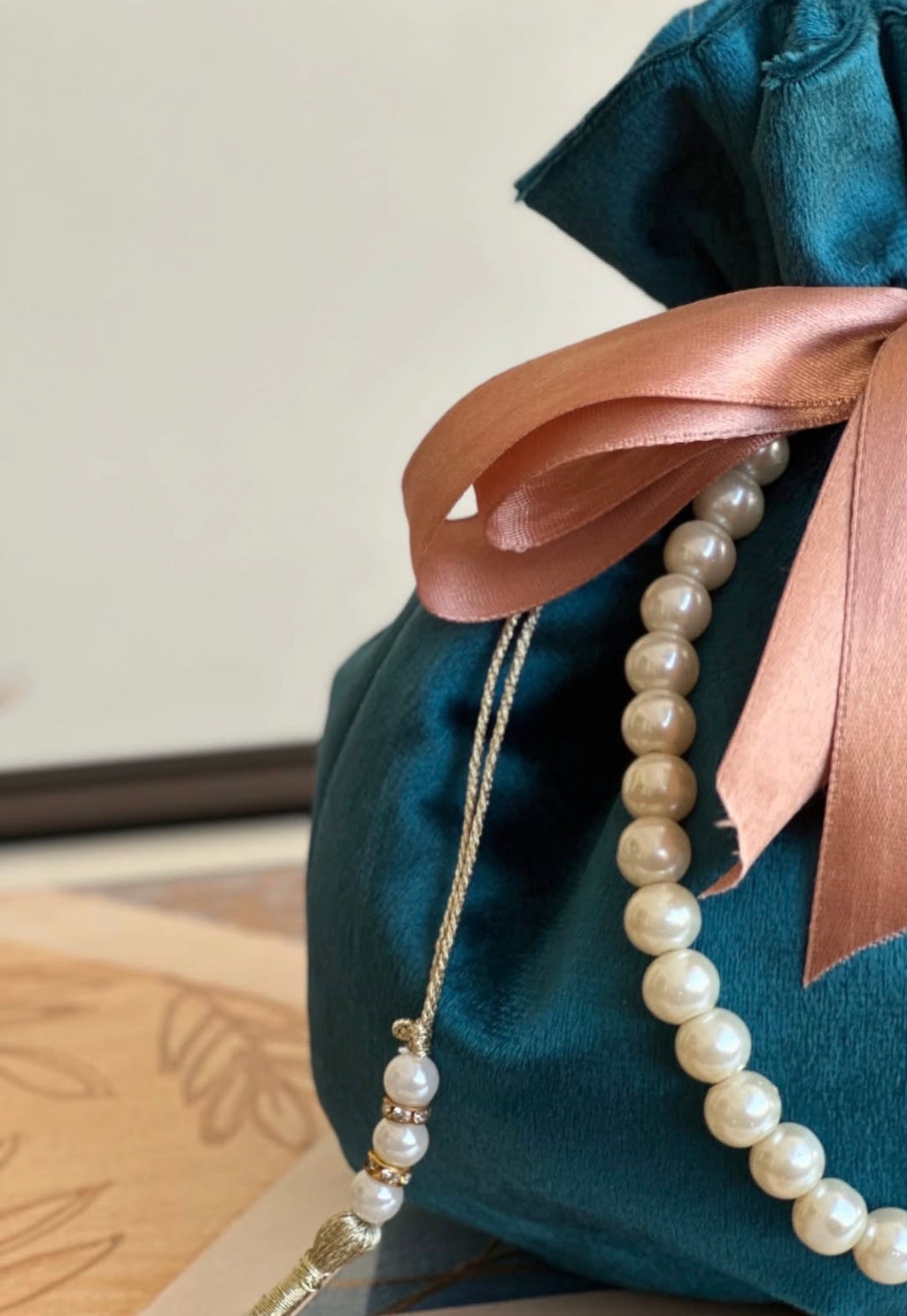 Tehzeeb: Teal Velvet Potli Bag with Satin Ribbon & Pearl Strap