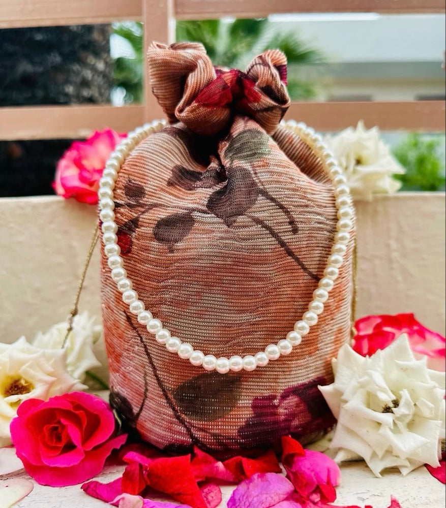 Zeenia: Crushed Georgette Potli Bag with Pearl Handle - Peach