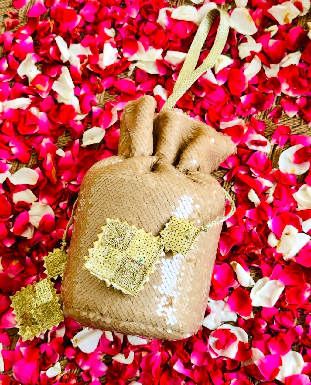 Sohaan: Champagne Gold Sequin Bucket Bag with Gota Tassels