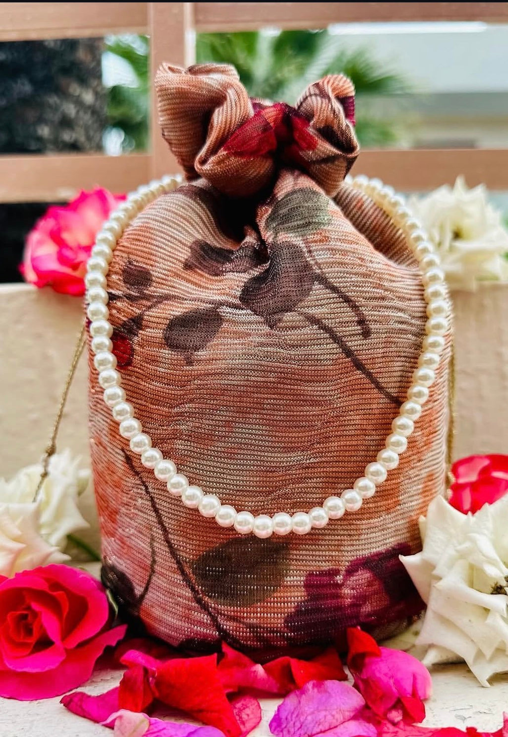Zeenia: Crushed Georgette Potli Bag with Pearl Handle - Peach