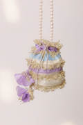Nigaar: Pastel Striped Potli with Gold Gota & Pearl Handle