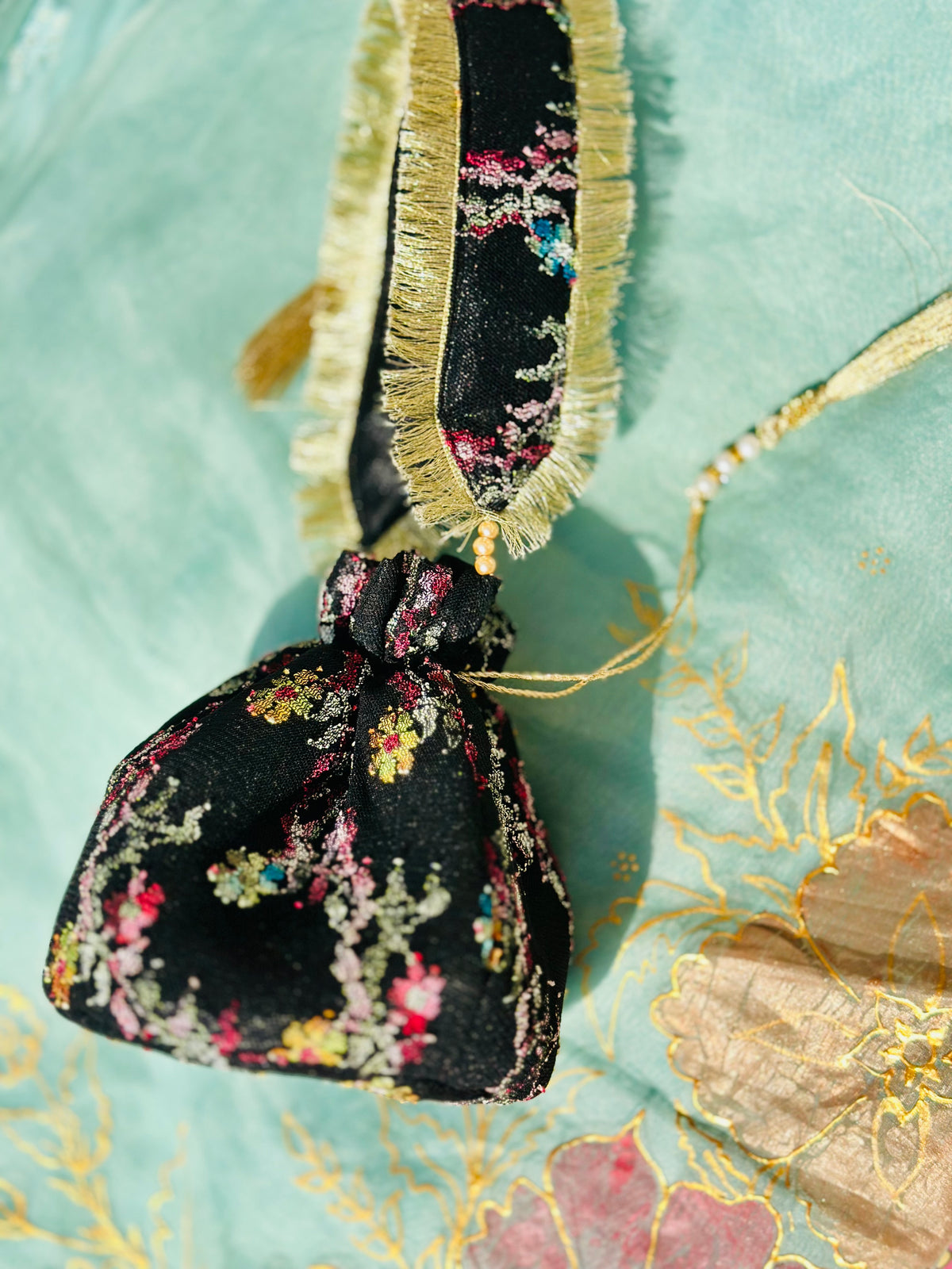 Sahar Handcrafted Floral Jacquard Potli Bag | Black & Gold Fringe Clutch