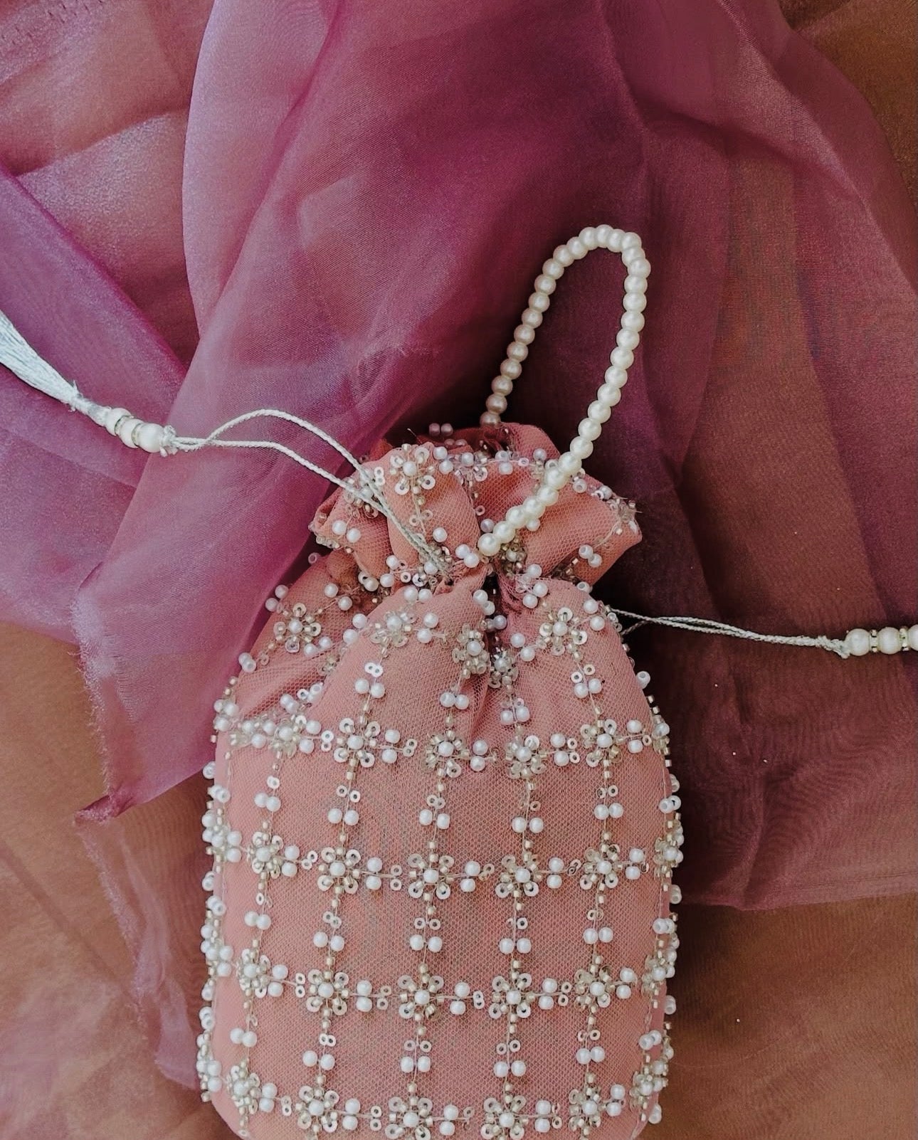 Shafaq: Pink Hand-Embroidered Pearl & Sequin Net Potli