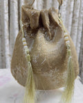 RUBAAB: Champagne Sequin Handcrafted Potli with handle