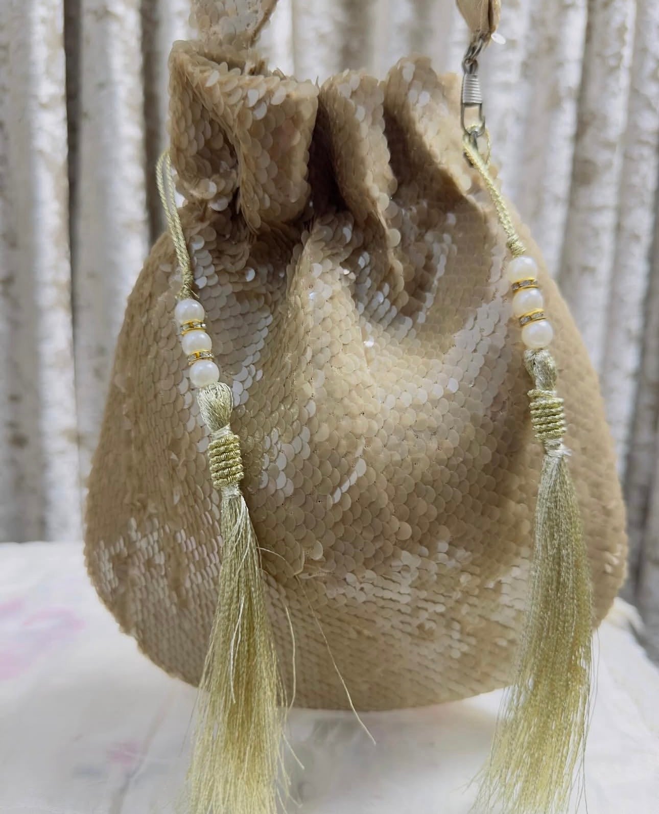 RUBAAB: Champagne Sequin Handcrafted Potli with handle