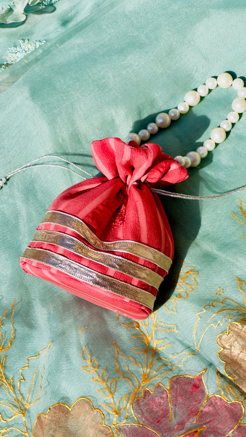 Handcrafted Coral Chiffon Potli Bag with Pearl Handle & Silver Gota Lace - Striped Festive Clutch