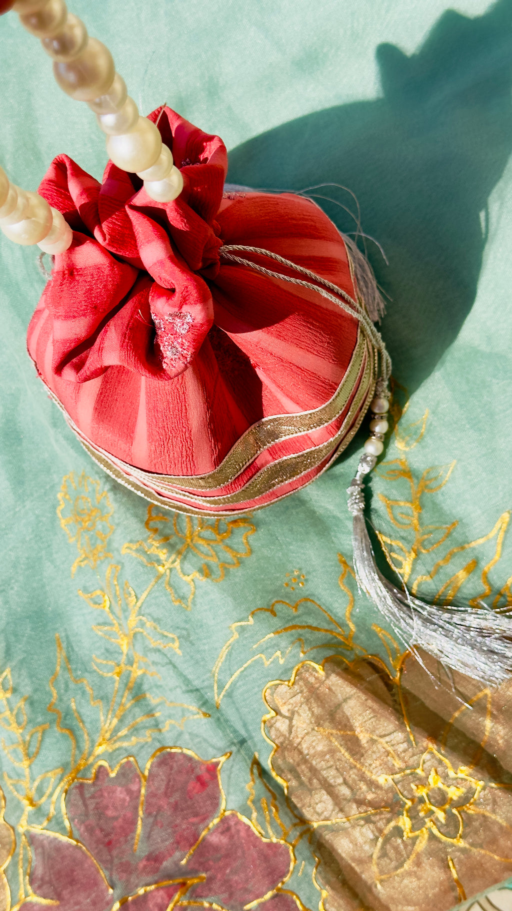 Handcrafted Coral Chiffon Potli Bag with Pearl Handle & Silver Gota Lace - Striped Festive Clutch