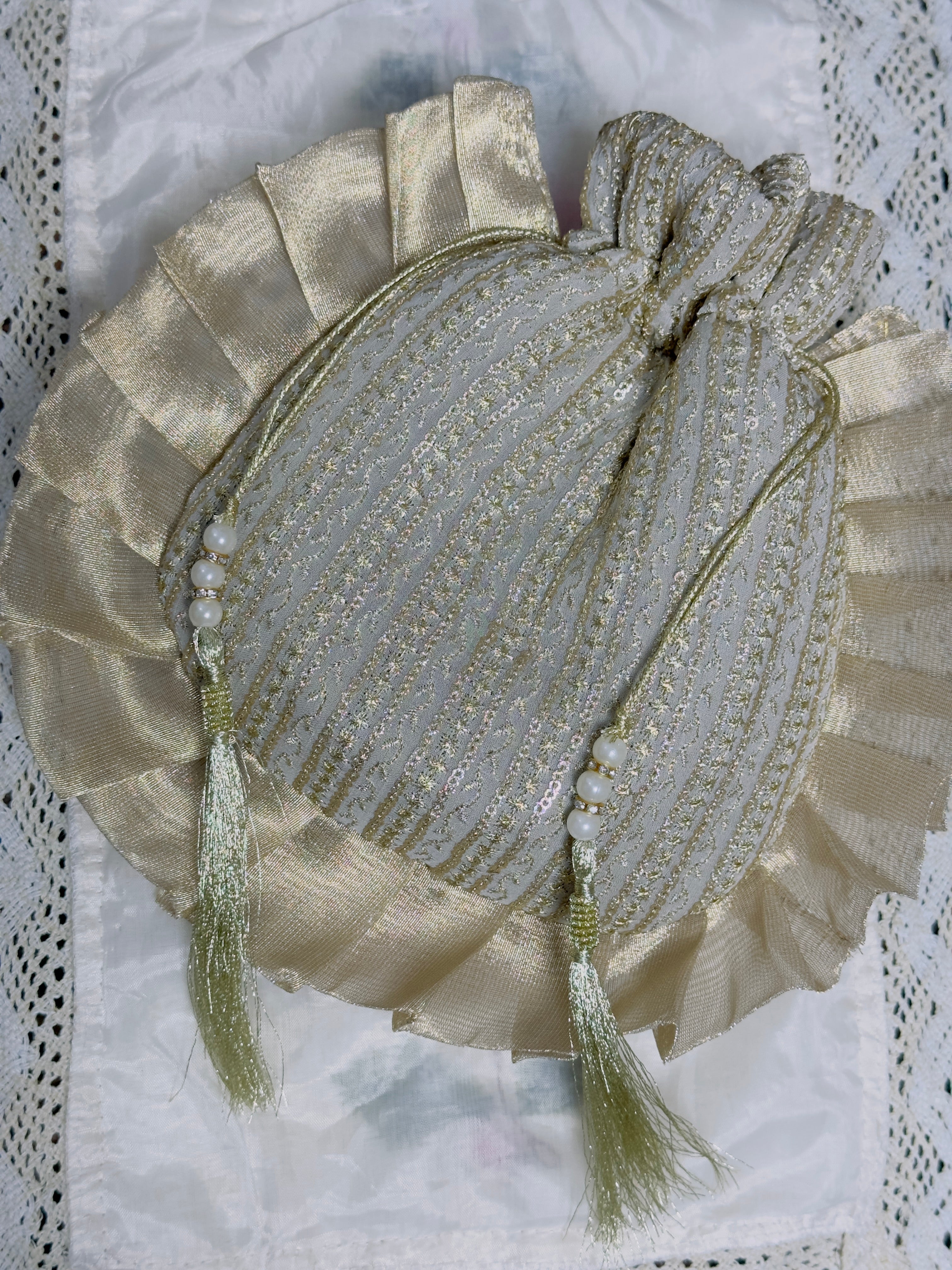 Nishat نشاط: Designer Gold Pleated Potli Bag with Pearl Tassels for Weddings