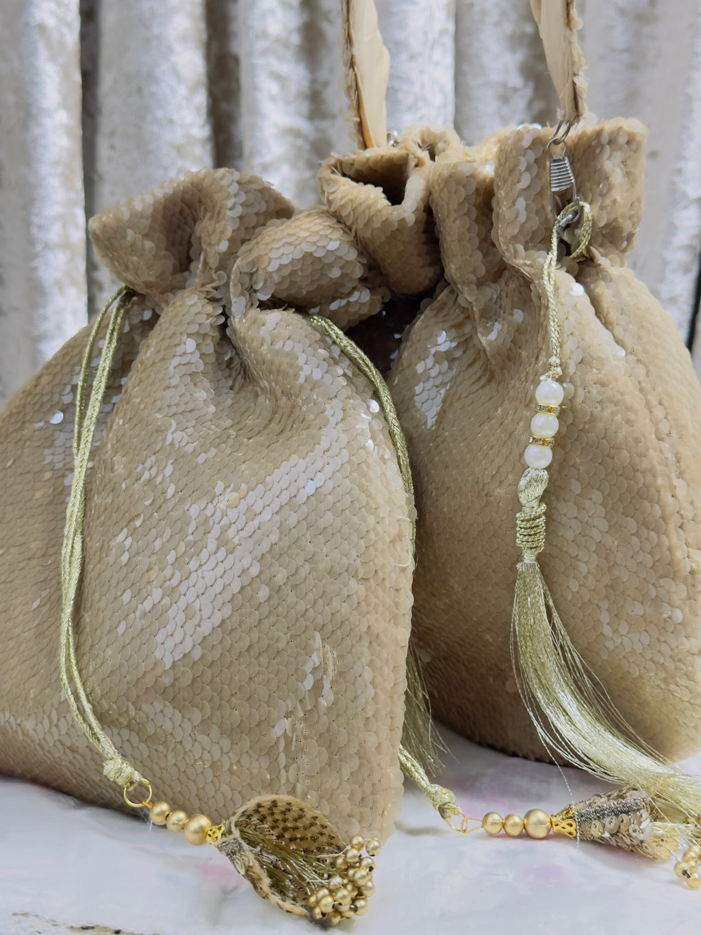RUBAAB: Champagne Sequin Handcrafted Potli with handle