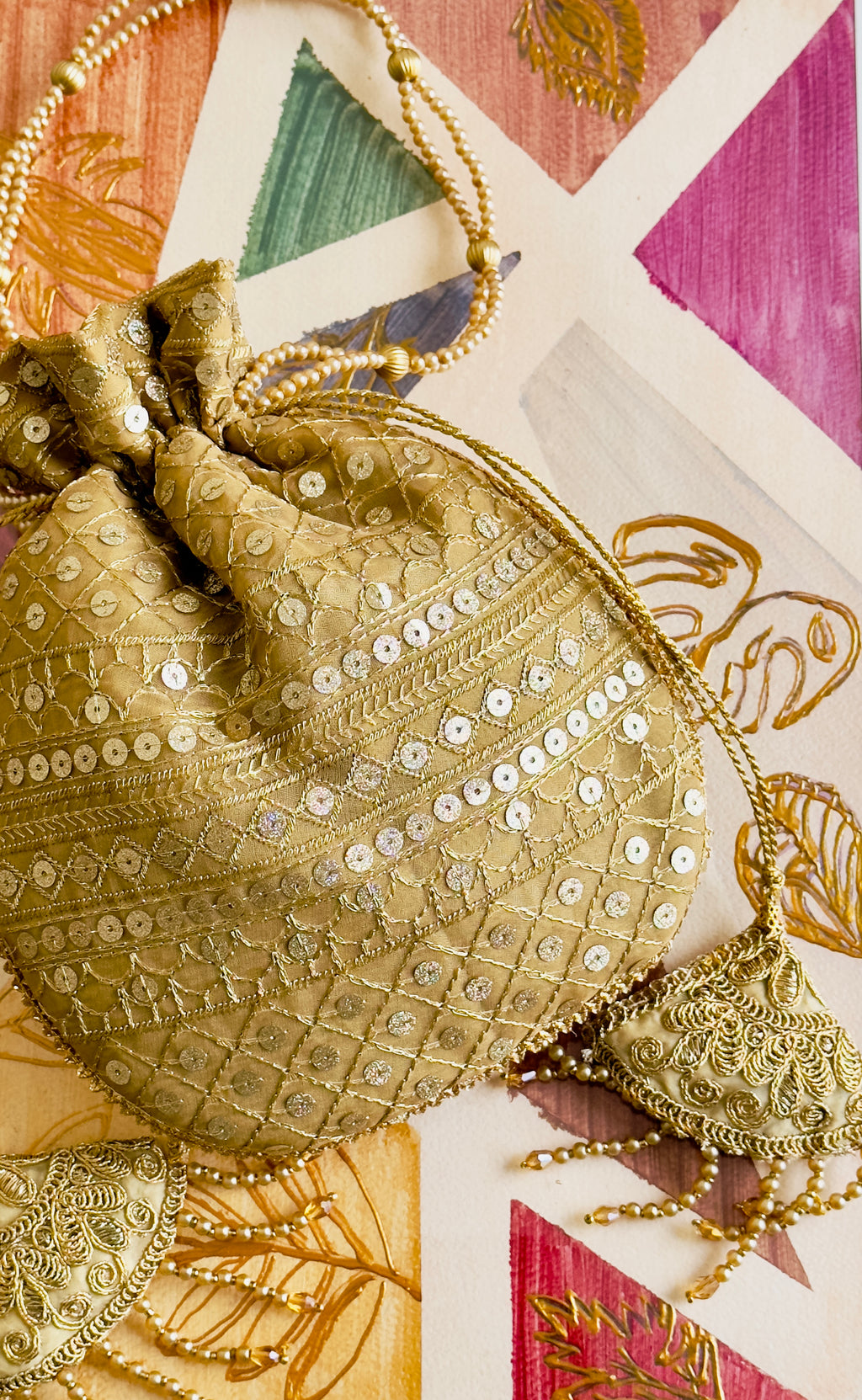 Zarnaab (زرناب): Golden Hand-Embellished Bridal Potli