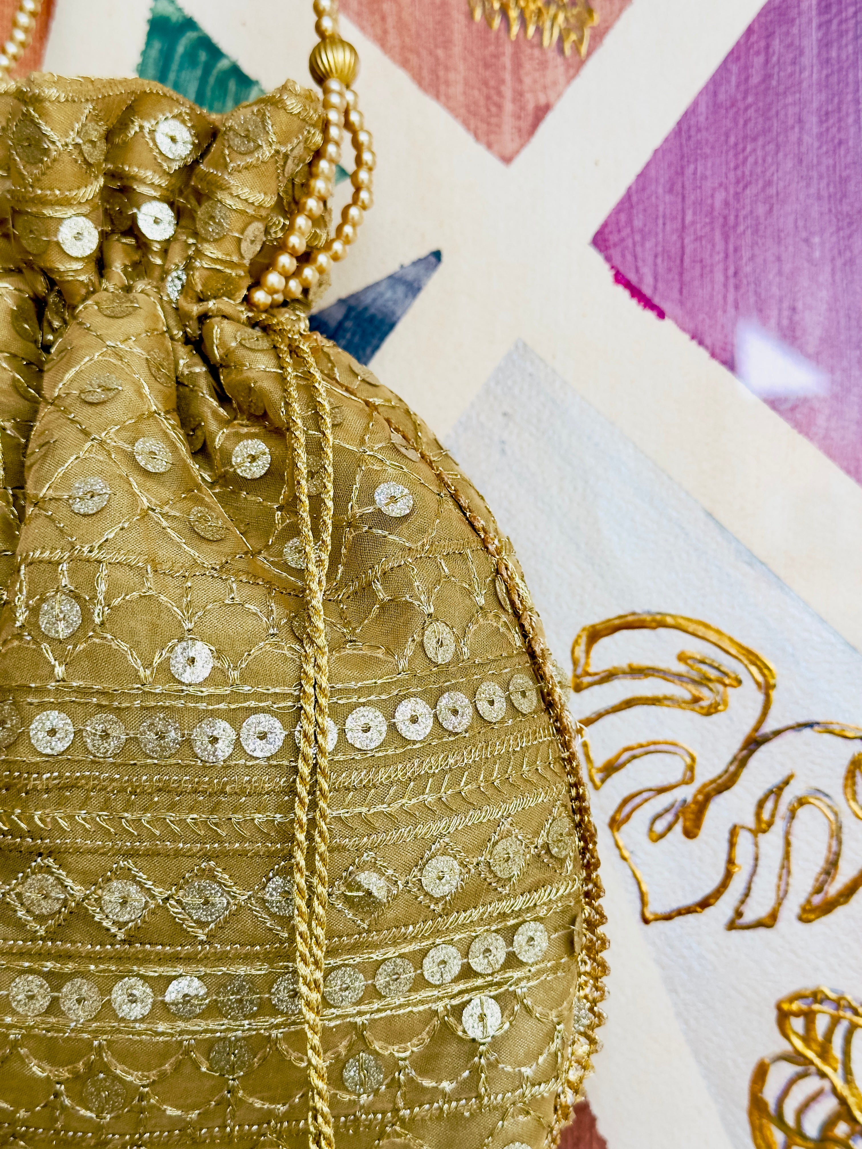 Zarnaab (زرناب): Golden Hand-Embellished Bridal Potli
