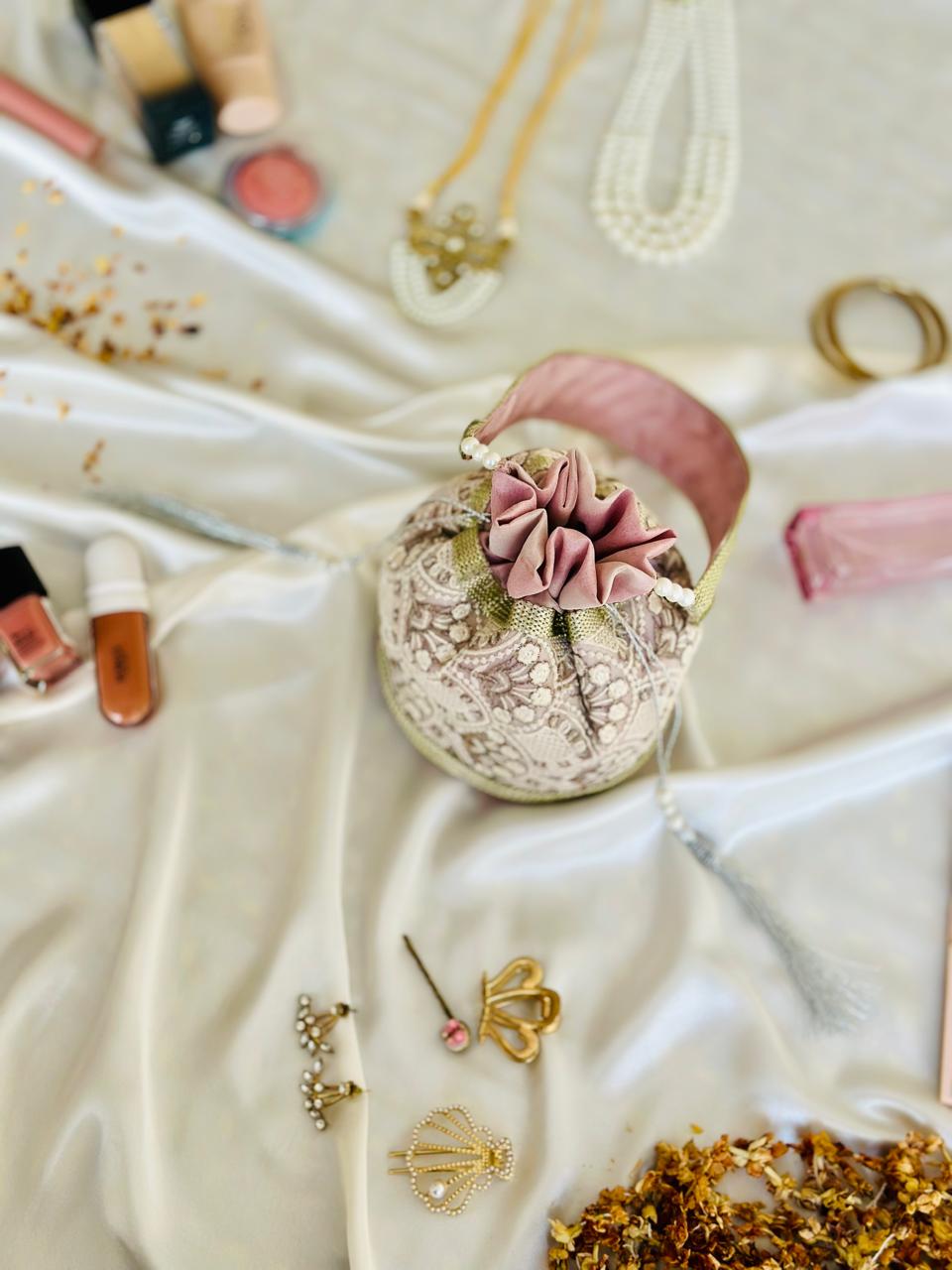 Nishaat: Blush Pink Lattice Embroidered Potli Bag