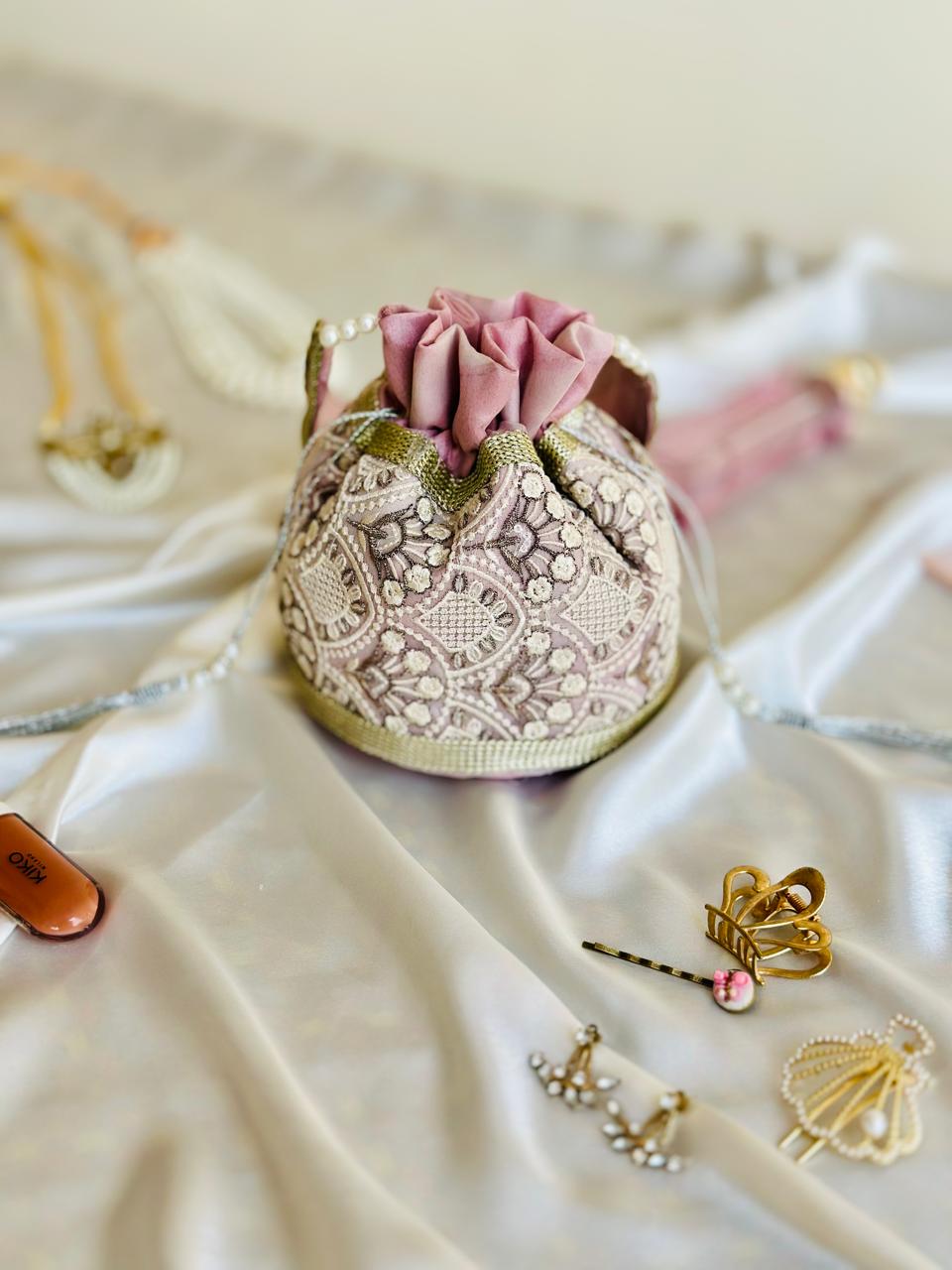 Nishaat: Blush Pink Lattice Embroidered Potli Bag