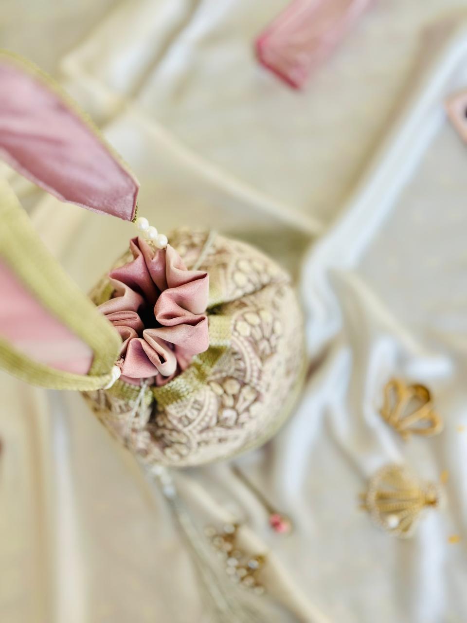 Nishaat: Blush Pink Lattice Embroidered Potli Bag