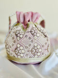 Nishaat: Blush Pink Lattice Embroidered Potli Bag