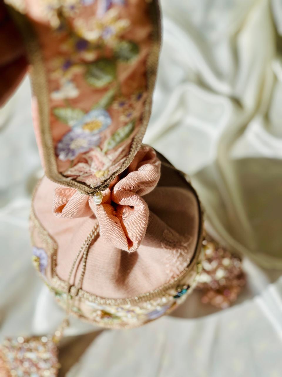 Mah-e-Zar: Pink Net Potli with Floral Appliqué & Tassels