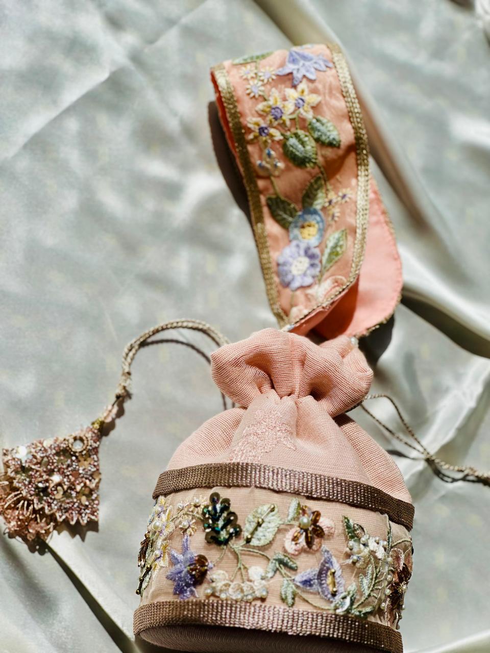 Mah-e-Zar: Pink Net Potli with Floral Appliqué & Tassels