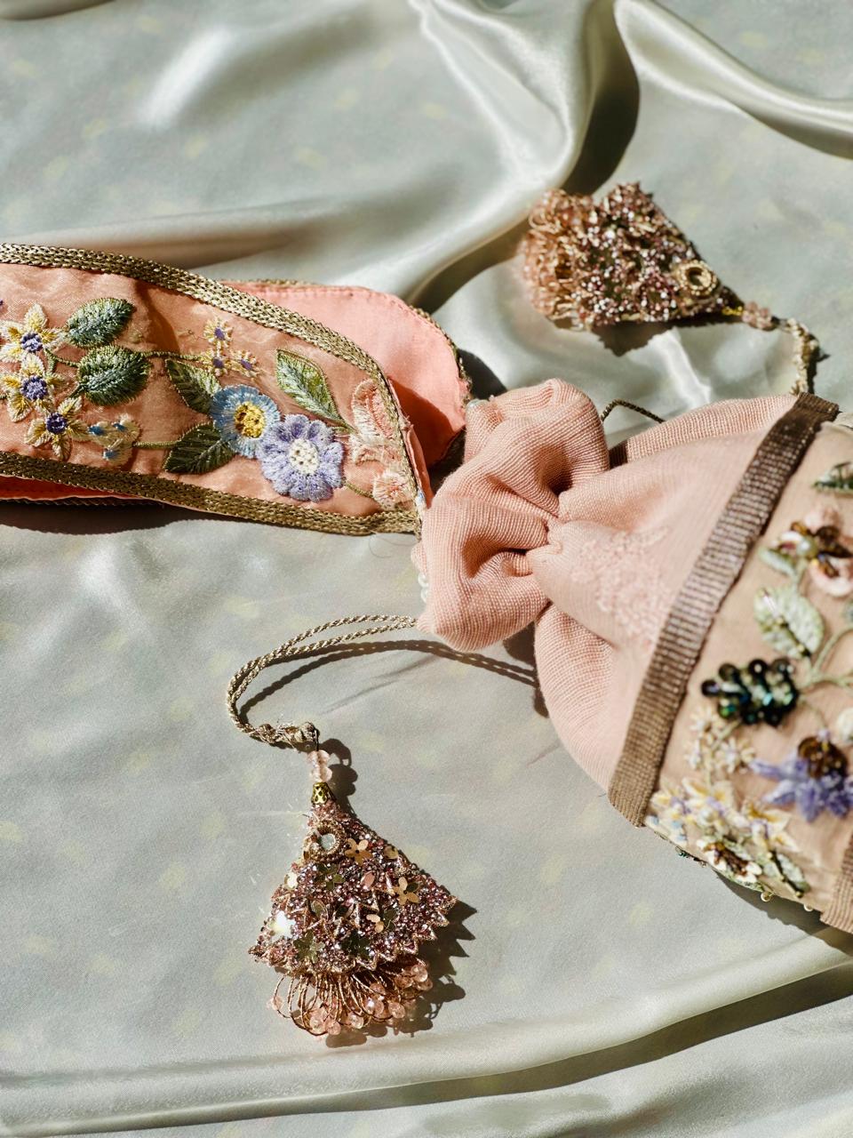 Mah-e-Zar: Pink Net Potli with Floral Appliqué & Tassels