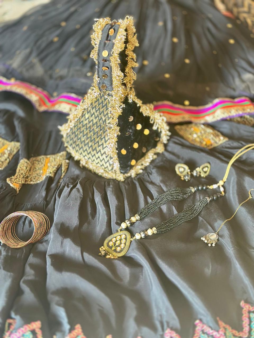 Surmai: Black & Gold Chevron Hand-Embellished Potli
