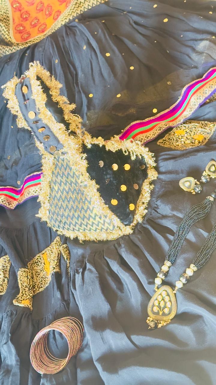 Surmai: Black & Gold Chevron Hand-Embellished Potli