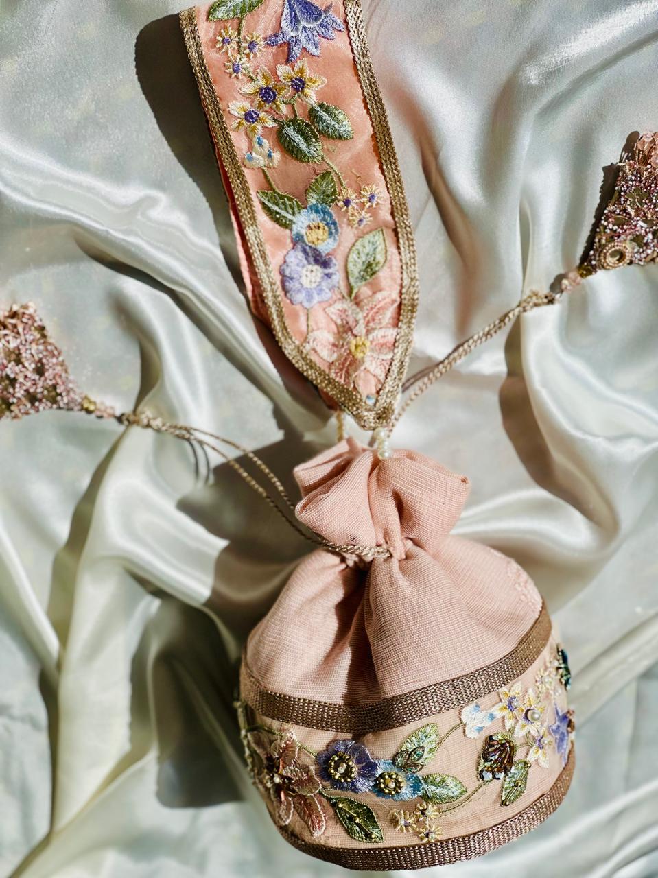 Mah-e-Zar: Pink Net Potli with Floral Appliqué & Tassels