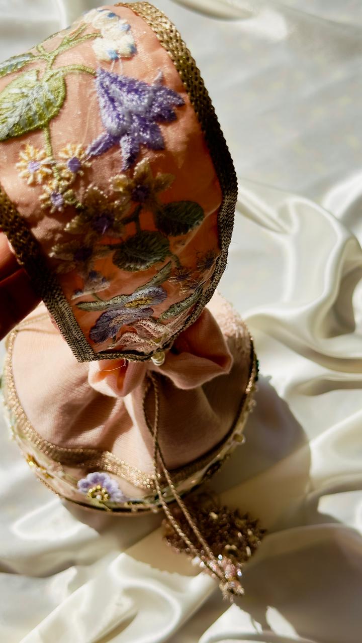 Hand-Embroidered Net Potli Bag with Floral Appliqué & Statement Tassels - Peach