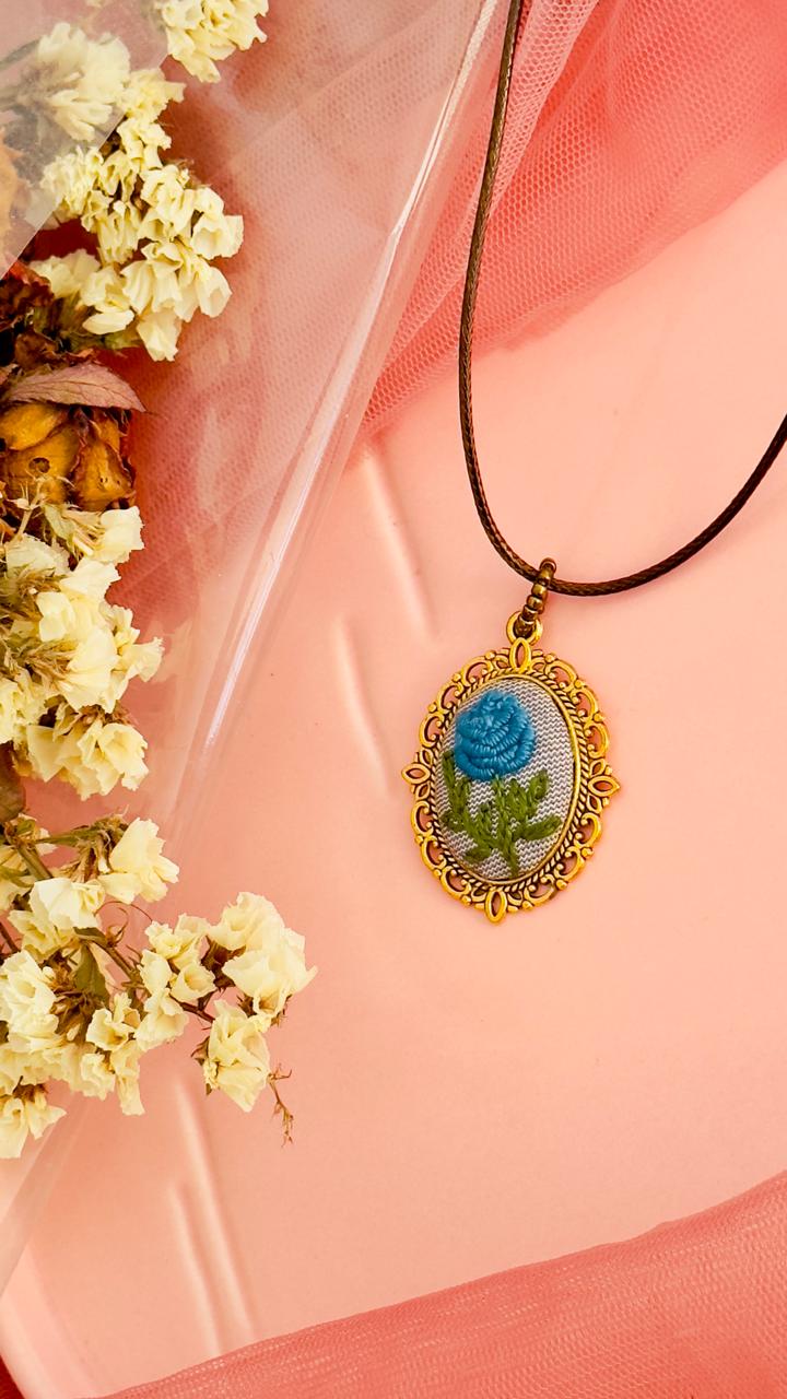 Hand-Embroidered Blue Rose Pendant - Vintage Gold Filigree Cameo Necklace - Artisan Hand-Stitched Jewelry