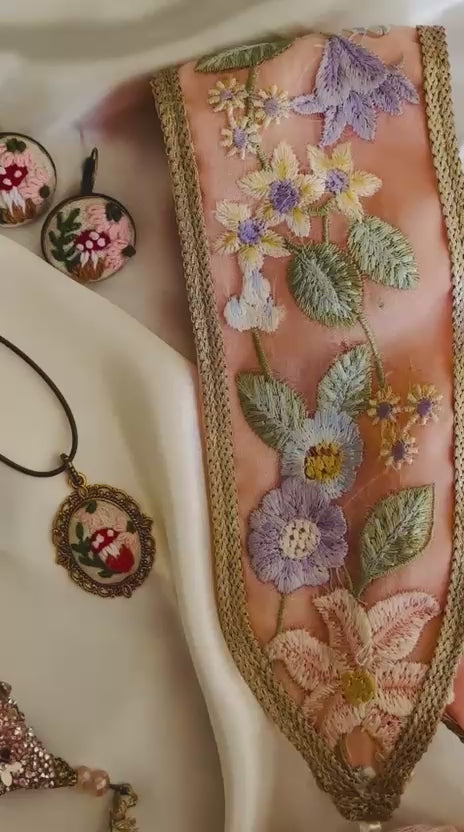 Mah-e-Zar: Pink Net Potli with Floral Appliqué & Tassels