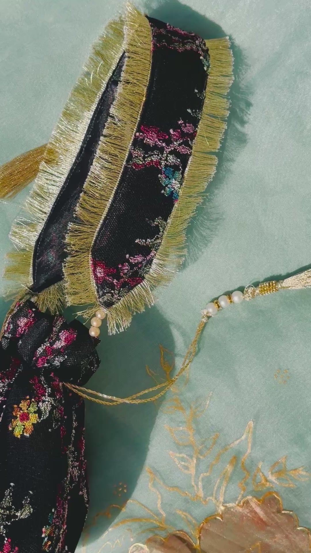 Sahar Handcrafted Floral Jacquard Potli Bag | Black & Gold Fringe Clutch