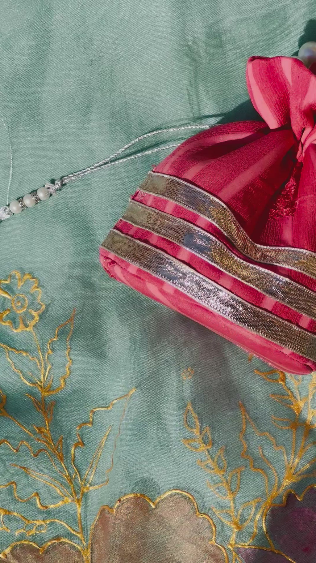 Bakhtawar: Coral Chiffon Potli with Pearl Handle & Silver Gota