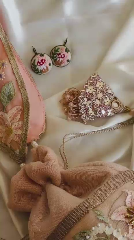 Mah-e-Zar: Pink Net Potli with Floral Appliqué & Tassels